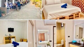 A hotel with a covered outdoor seating area, a single bed with a wooden frame, a bathroom with a wooden vanity, and a television in a room.