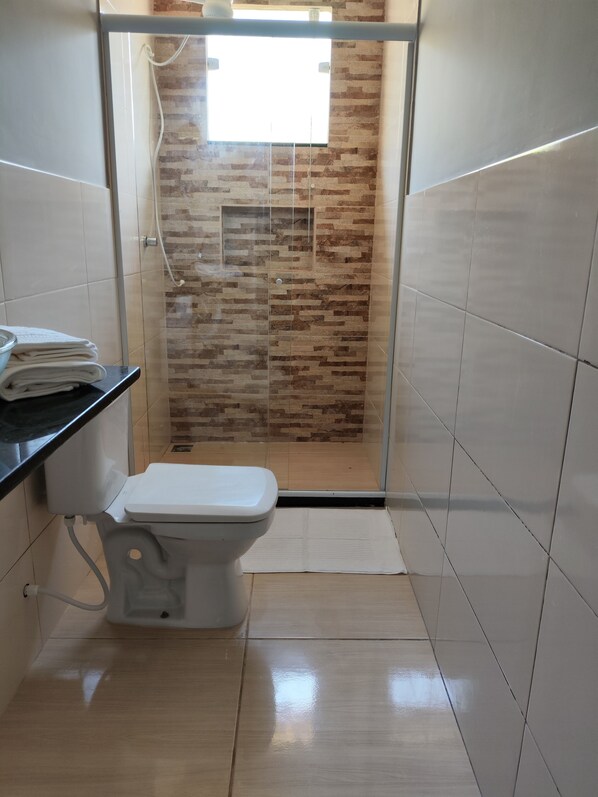 Shower, towels, soap, toilet paper