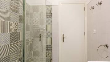 Shower, hair dryer, towels, toilet paper