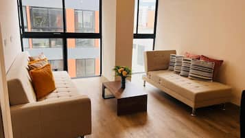 Exclusive Apartment | Living area | 60-inch flat-screen TV with satellite channels, heated floors