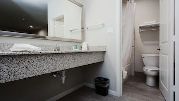 Combined shower/tub, towels, soap, shampoo