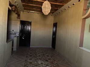 Deluxe Apartment | Living area | Flat-screen TV