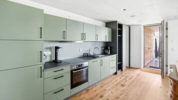 Fridge, stovetop, dishwasher, coffee/tea maker