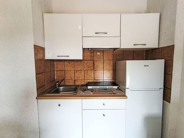 Fridge, toaster, highchair, cookware/dishes/utensils