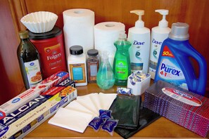 A variety of household items including paper towels, cleaning supplies, and personal care products.