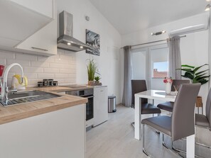 Fridge, oven, cookware/dishes/utensils