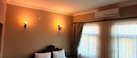 Standard Quadruple Room | In-room safe, desk, blackout curtains, iron/ironing board (on request)