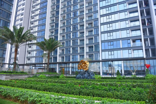 A modern building with multiple floors and large windows.