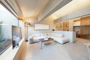 Premium Loft Suite | Living area | 65-inch Smart TV with digital channels