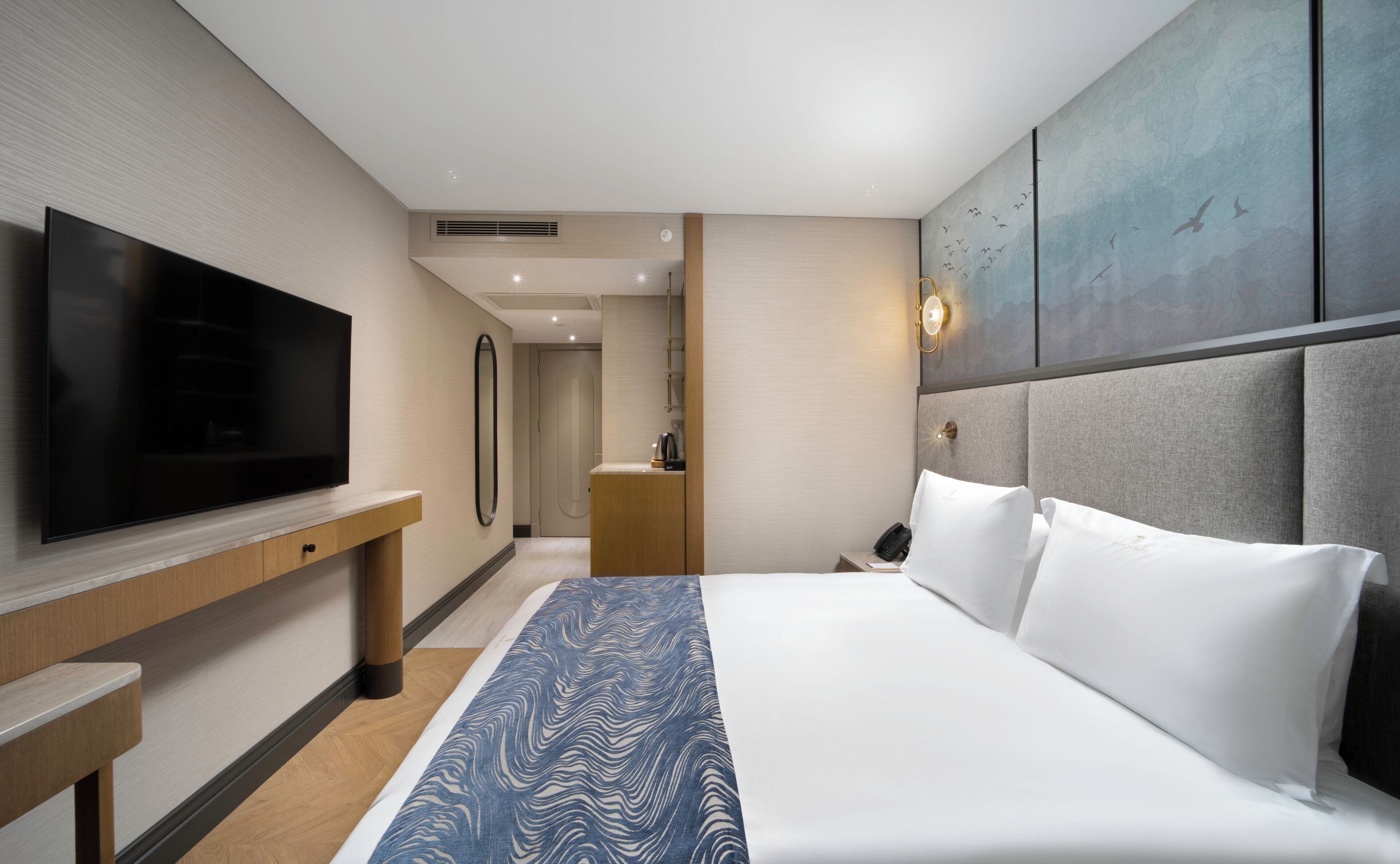 Luxe beddengoed, een minibar, een kluis op de kamer, een laptopwerkplek