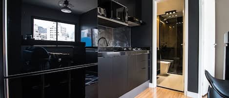 Fridge, microwave, coffee/tea maker, cookware/dishes/utensils