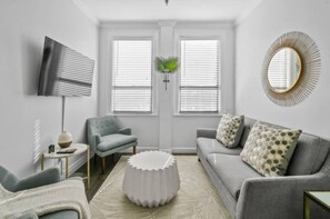 Comfortable sitting room with mirror