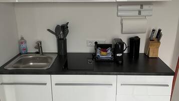 Fridge, microwave, stovetop, coffee/tea maker