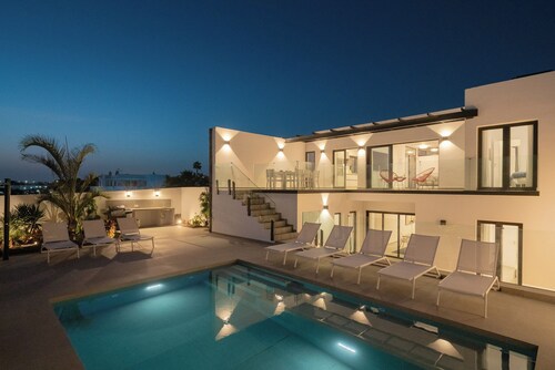 SUNSET SIGHTS by Buenavilla | Modern ocean-view villa with heated pool