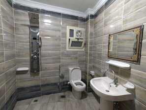 Shower, hair dryer, towels, soap