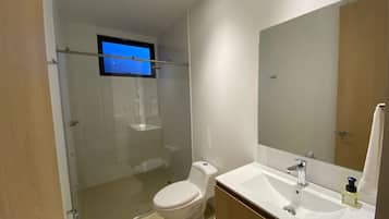 Shower, rainfall showerhead, towels, soap