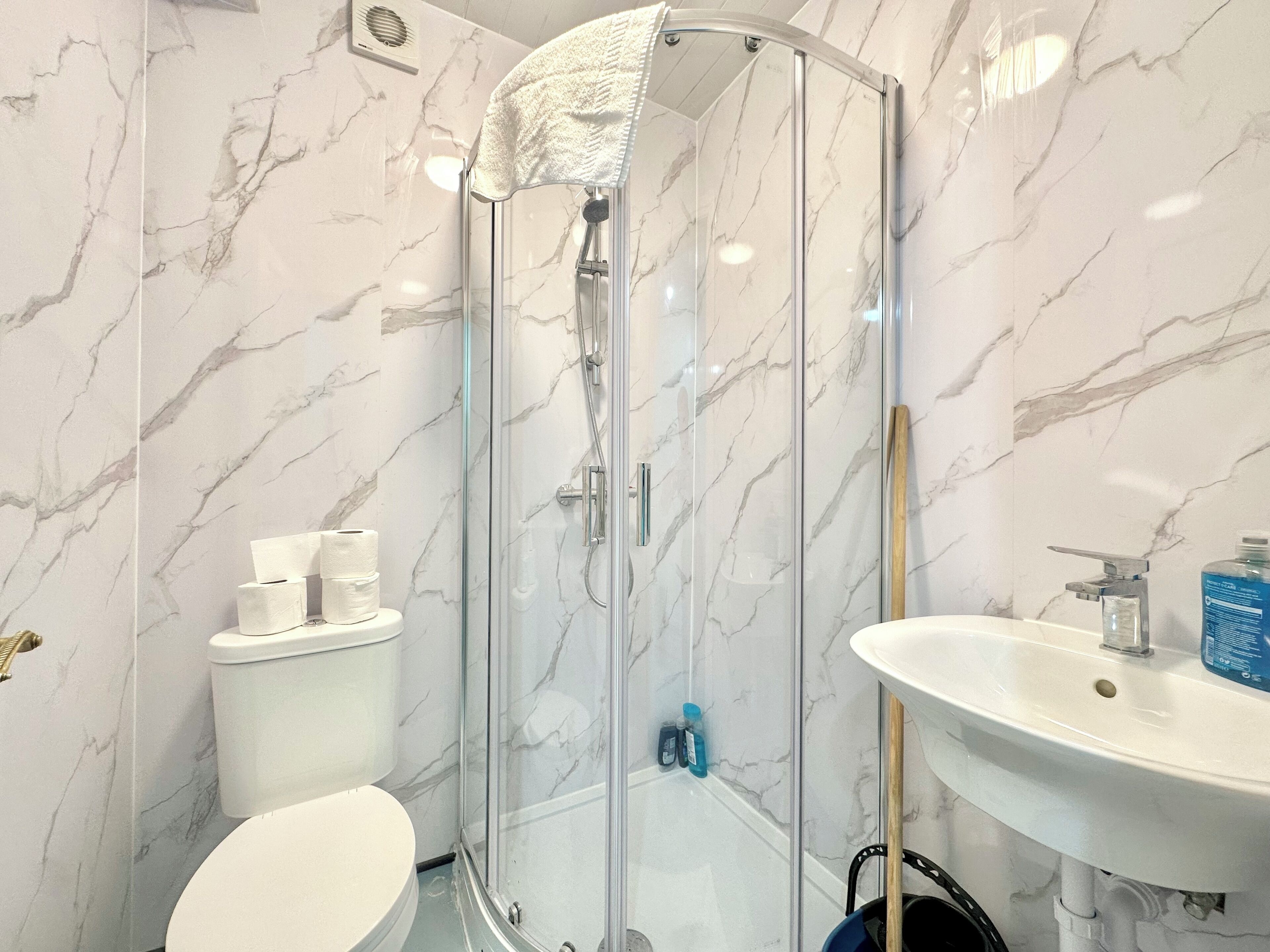 Shower, hair dryer, towels, soap