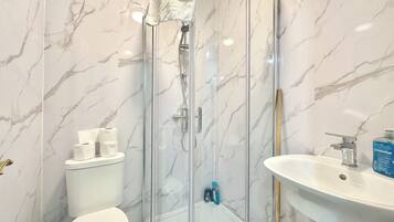 Shower, hair dryer, towels, soap