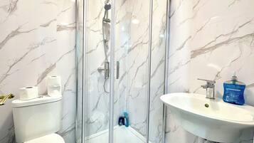 Shower, hair dryer, towels, soap