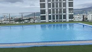 A modern building with a rooftop pool. - Sunset Sea Hotel (Da Nang)