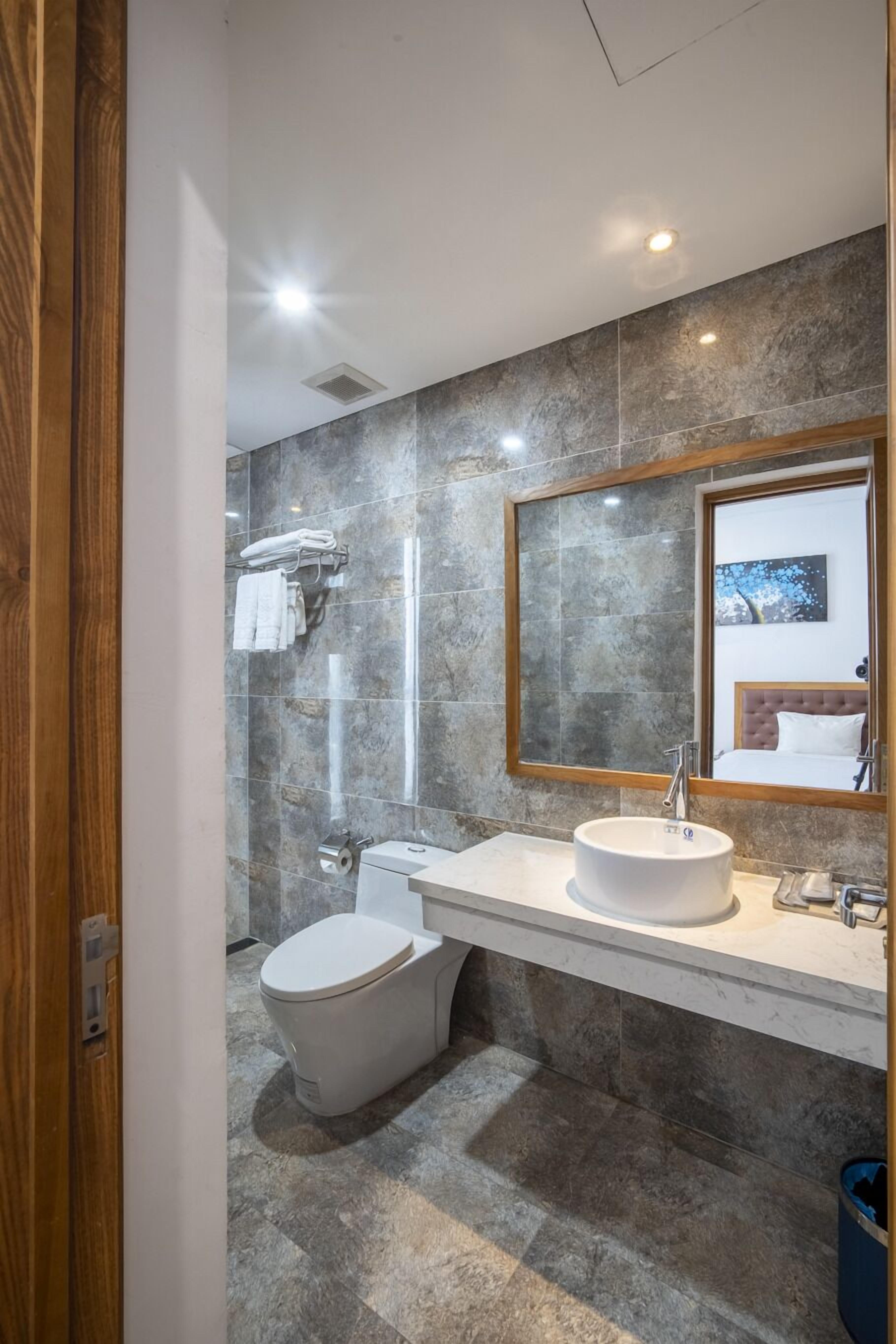 Deluxe-Zimmer | Badezimmer | Haartrockner, Handtücher