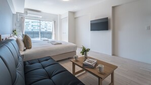 Family Twin Room | Living area | 40-inch flat-screen TV with digital channels
