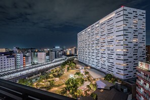 A modern hotel with a unique facade, a covered outdoor area, and a view of the surrounding cityscape. - ESLEAD HOTEL Osaka Ebisu (Osaka)