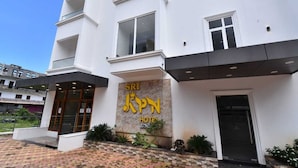 A modern hotel entrance with a prominent sign reading "SRI KPN HOTEL". - Hotel SRI KPN (Port Blair)