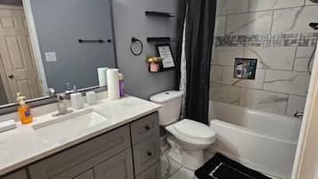 Hair dryer, towels, soap, toilet paper