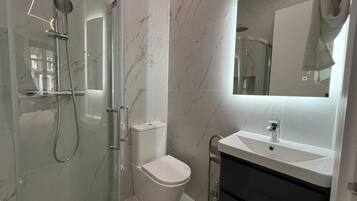 Hair dryer, towels, soap, shampoo