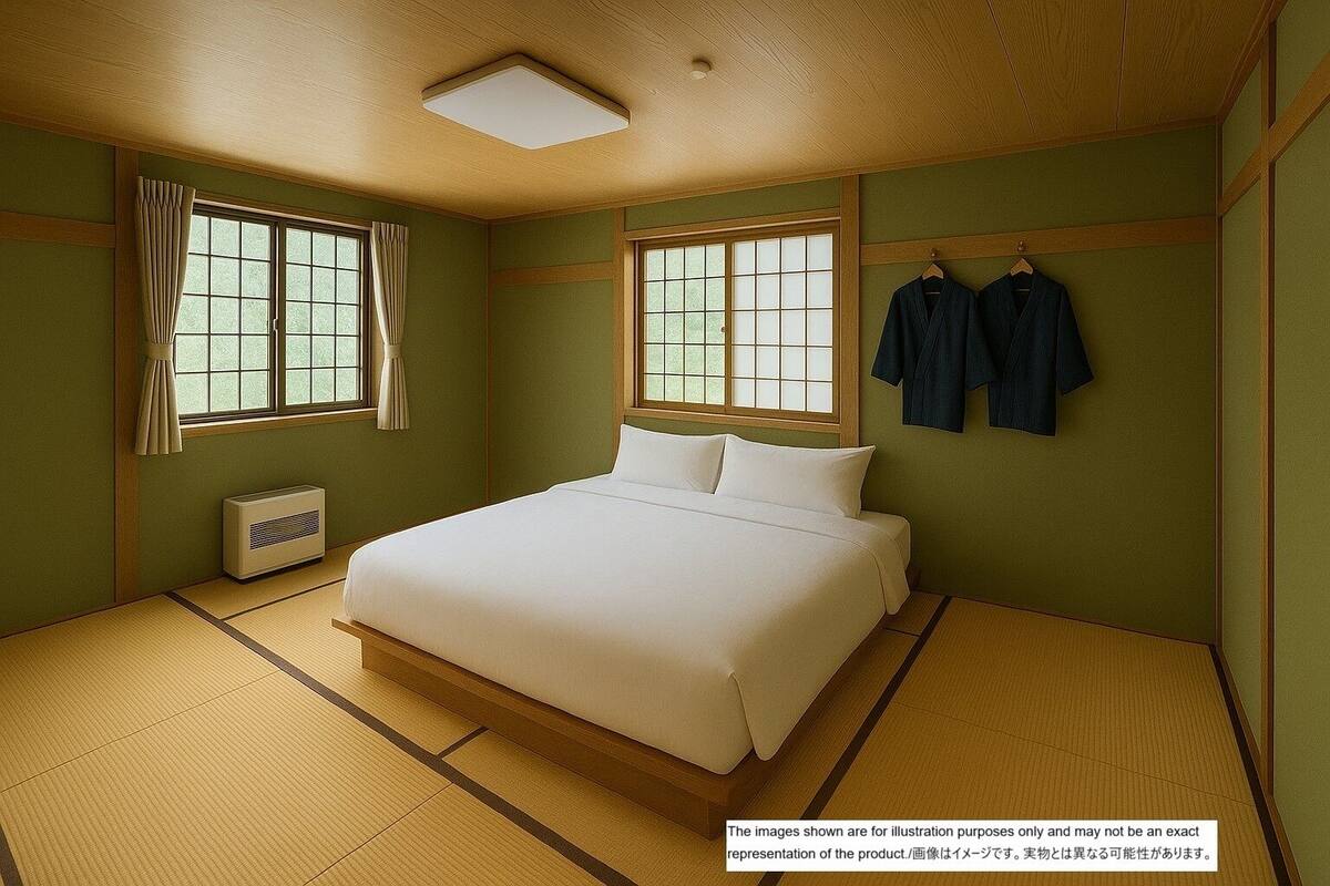 A traditional Japanese-style bedroom with tatami flooring, a bed, two windows with curtains, a radiator, and a hanging clothes rack.