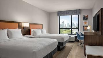 Hypo-allergenic bedding, desk, laptop workspace, blackout drapes