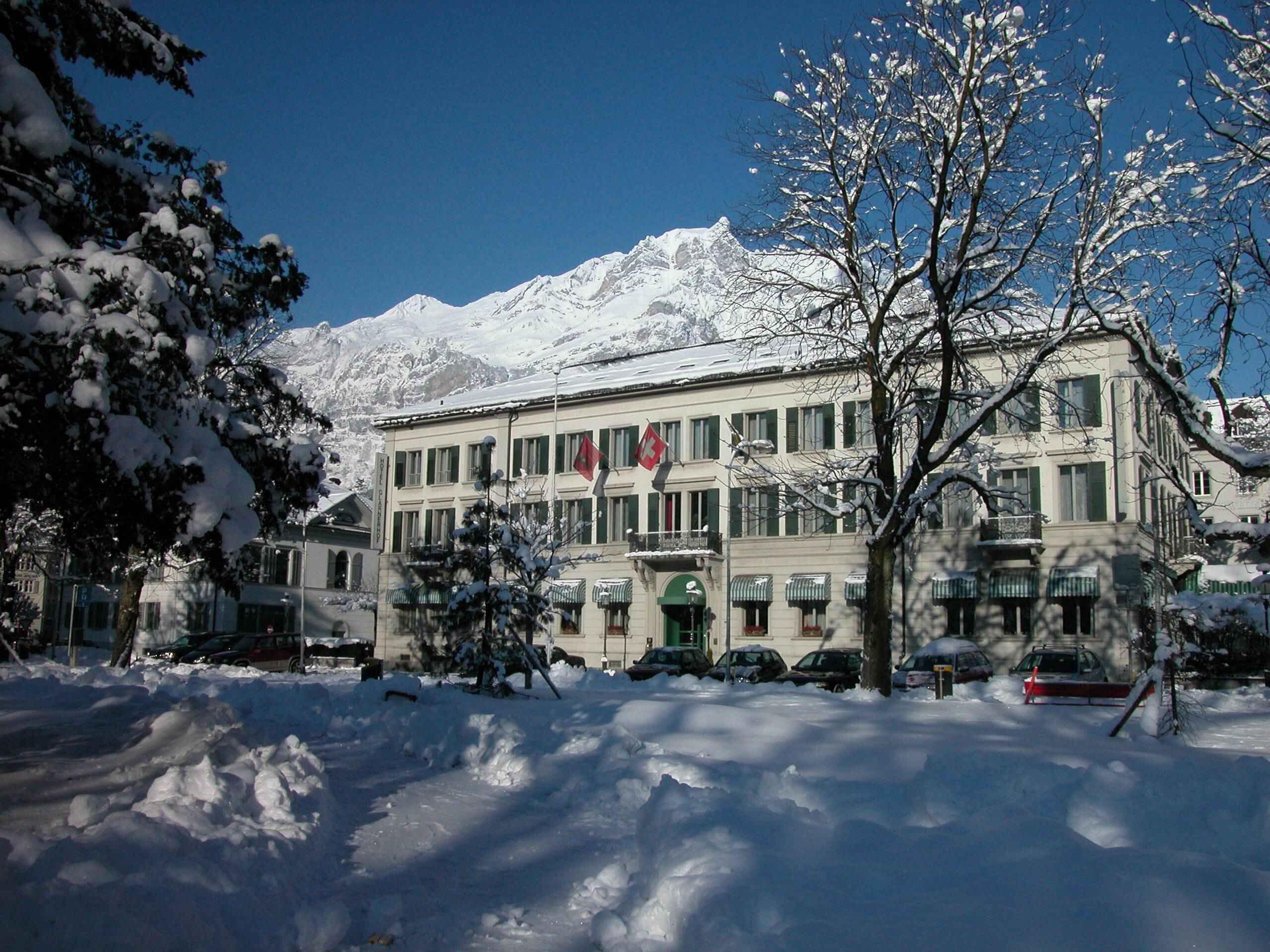 A building with a snow-covered mountain in the background.