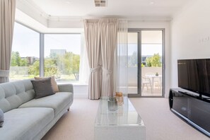 TV, fireplace - Modern Mansion in Lightsview | By Host Solutions (Lightsview)