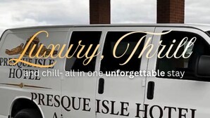 A luxury shuttle branded as Presque Isle Hotel Airport Shuttle.