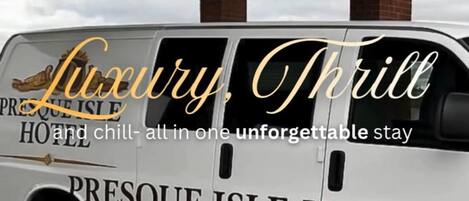 A luxury shuttle branded as Presque Isle Hotel Airport Shuttle.