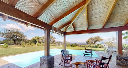 Beautiful farmhouse on a large lot with mountain views & a private pool