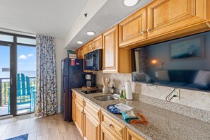Fridge, microwave, stovetop, coffee/tea maker