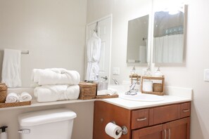 Shower, hair dryer, towels, soap