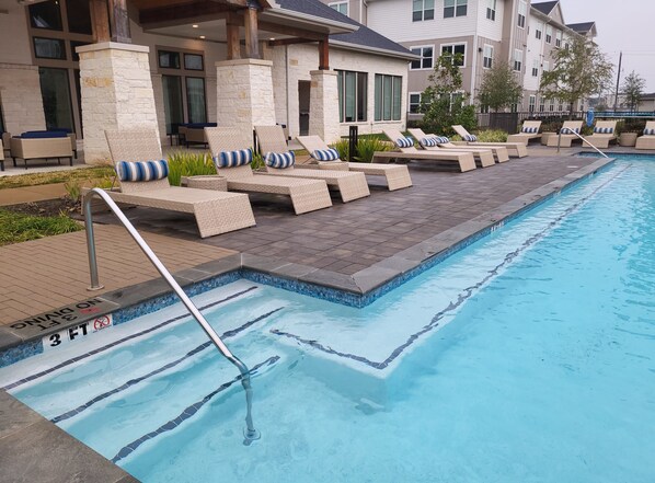 Pool - Cozy's long-term stay in King bed is in Friendswood, Texas, near Houston. (Friendswood)