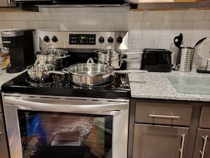 Fridge, microwave, oven, stovetop - Cozy's long-term stay in King bed is in Friendswood, Texas, near Houston. (Friendswood)