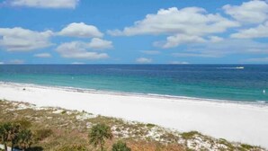 A beach with white sand and clear turquoise water. - Wonderful Avalon Condo (Ground Floor) - Renovated & Steps to Pool!!!🏝️ (Clearwater)