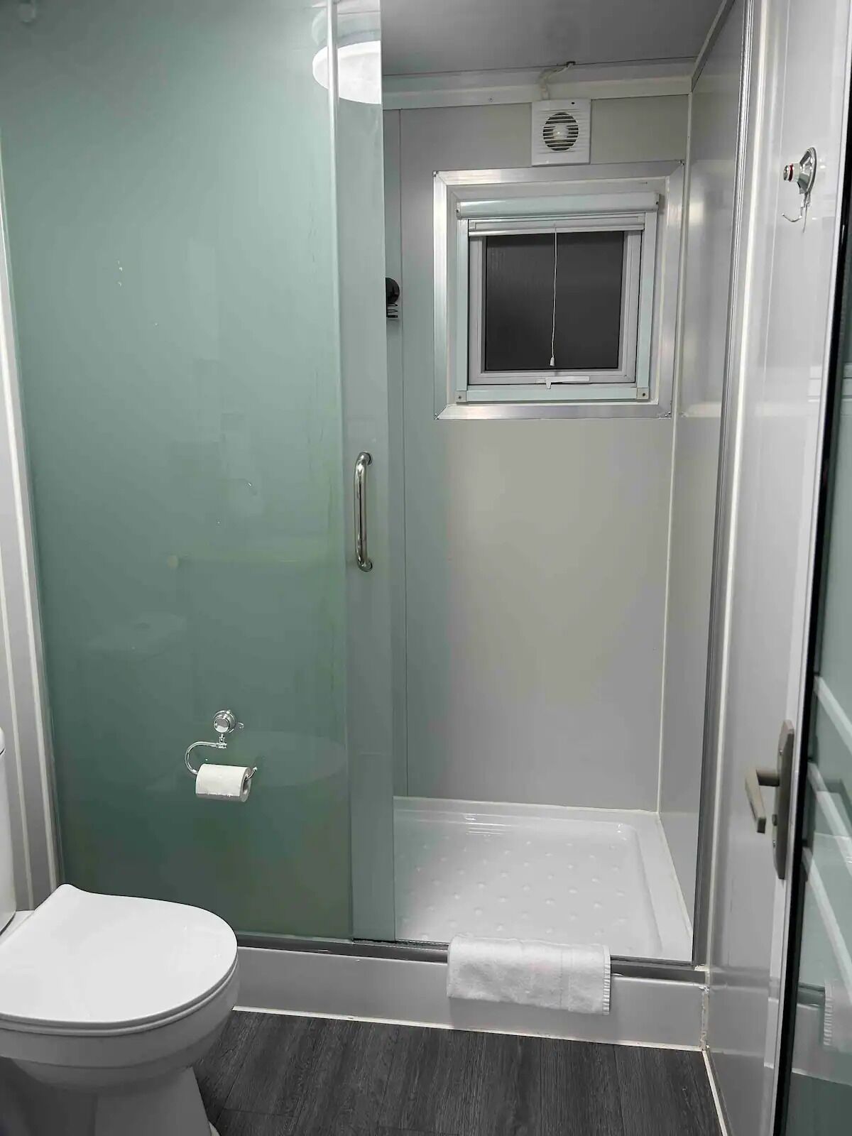 Shower, towels, soap, toilet paper