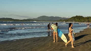 Beach nearby, white sand, beach towels