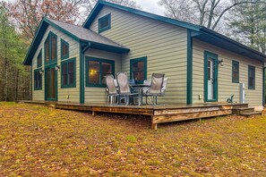 Outdoor dining - Spacious & peaceful lakefront villa with fire pit, patio, grill, & amazing views (Manitowish Waters)