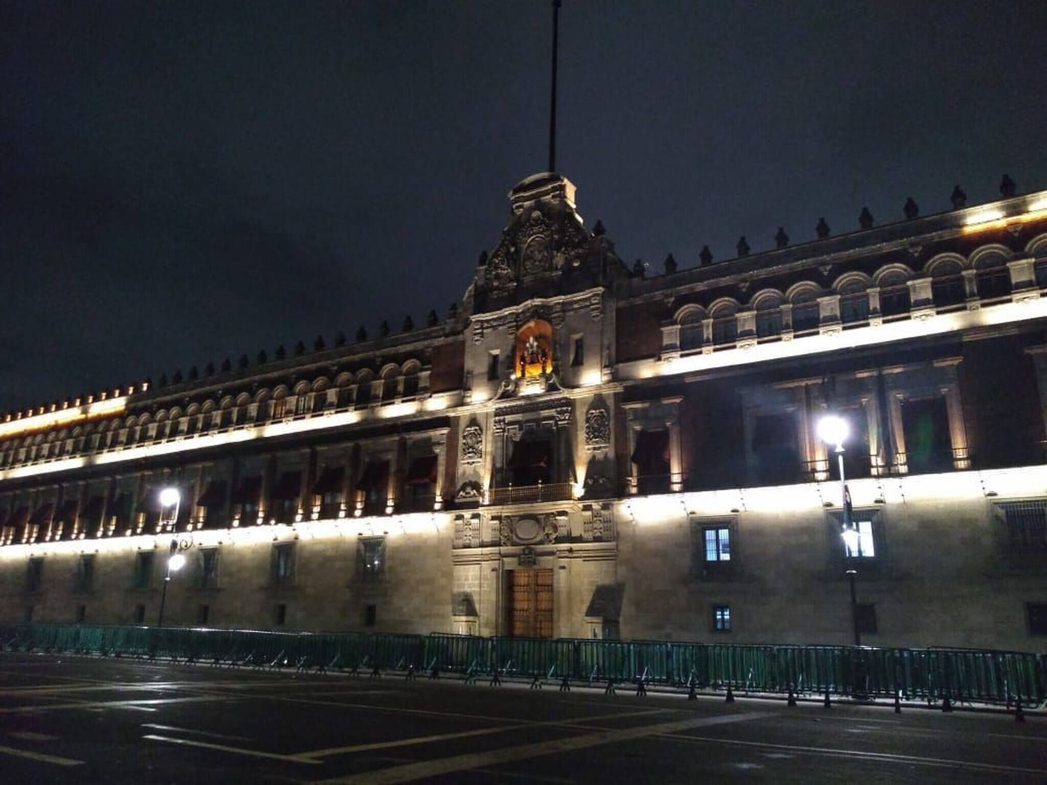 A large, historic building with ornate architecture, including a prominent central entrance and multiple windows.