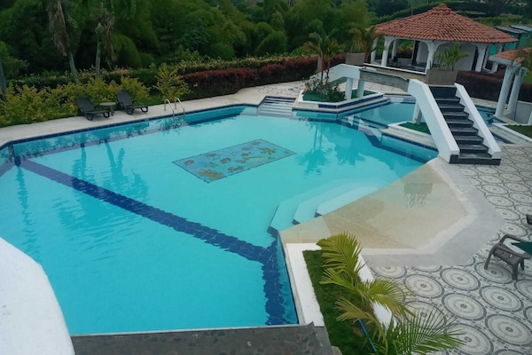 Outdoor pool, open 8:00 AM to 9:00 PM, pool umbrellas, sun loungers