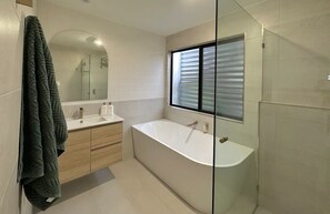 Shower, hair dryer, towels, soap