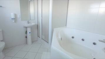 Shower, jetted tub, hair dryer, towels