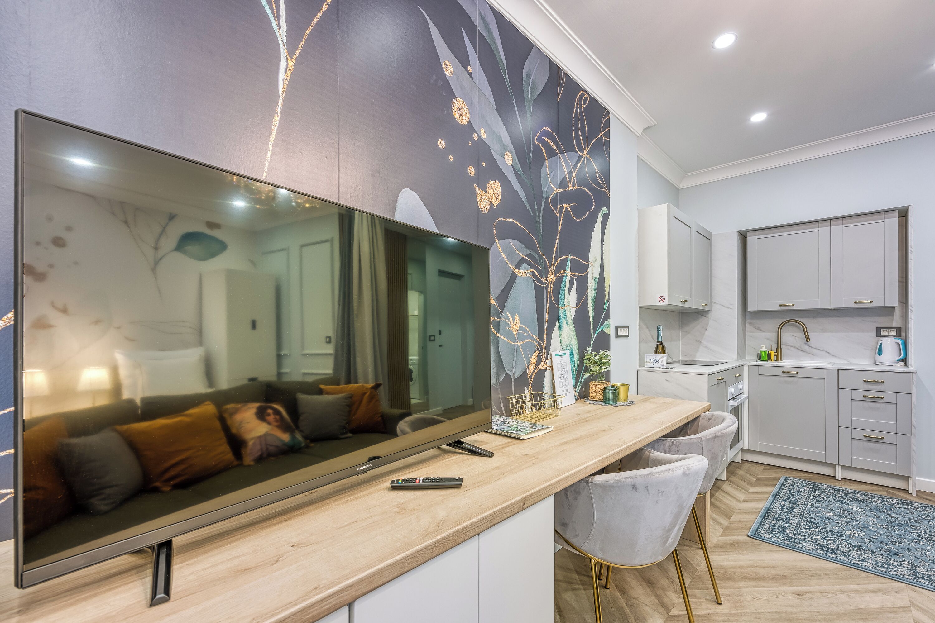 Family Studio (Boutique Downtown Studio with Balcony) | Living area | 21-inch flat-screen TV with digital channels